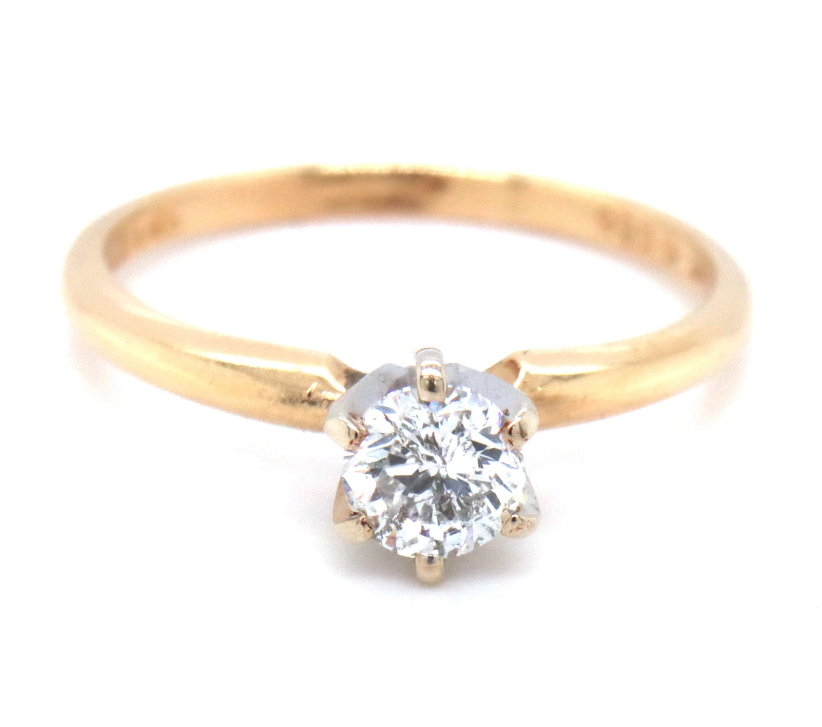 14kt Yellow gold diamond engagement ring: 14kt Yellow gold round brilliant cut diamond engagement ring. The total weight of the ring is 1.9 grams. Ring size 6".