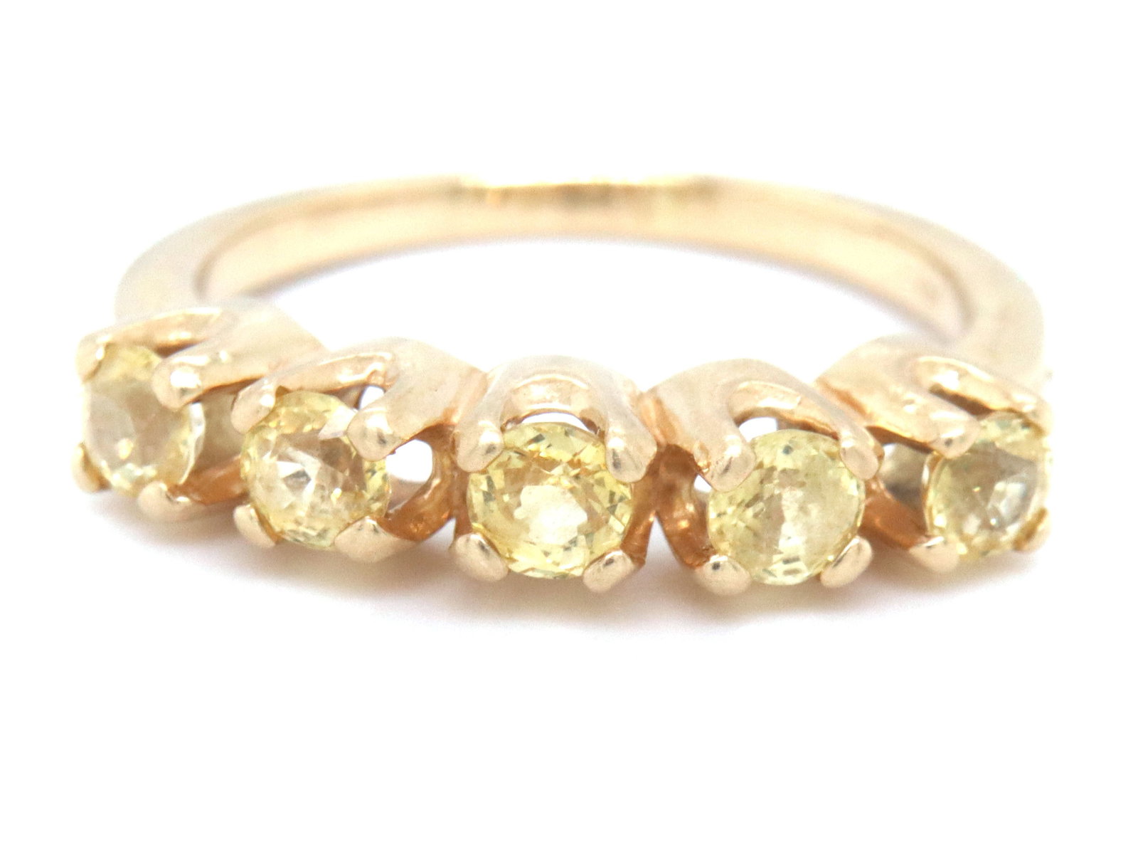 14kt Yellow gold 5 stone citrine band: 14kt Yellow gold 5 stone citrine band. The total weight of the band is 3.2 grams. Ring size 5".