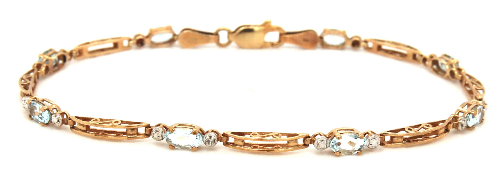 10kt Yellow gold blue topaz link bracelet: 10kt Yellow gold blue topaz link 7-inch bracelet with lobster clasp. The total weight of the bracelet is 3 grams.