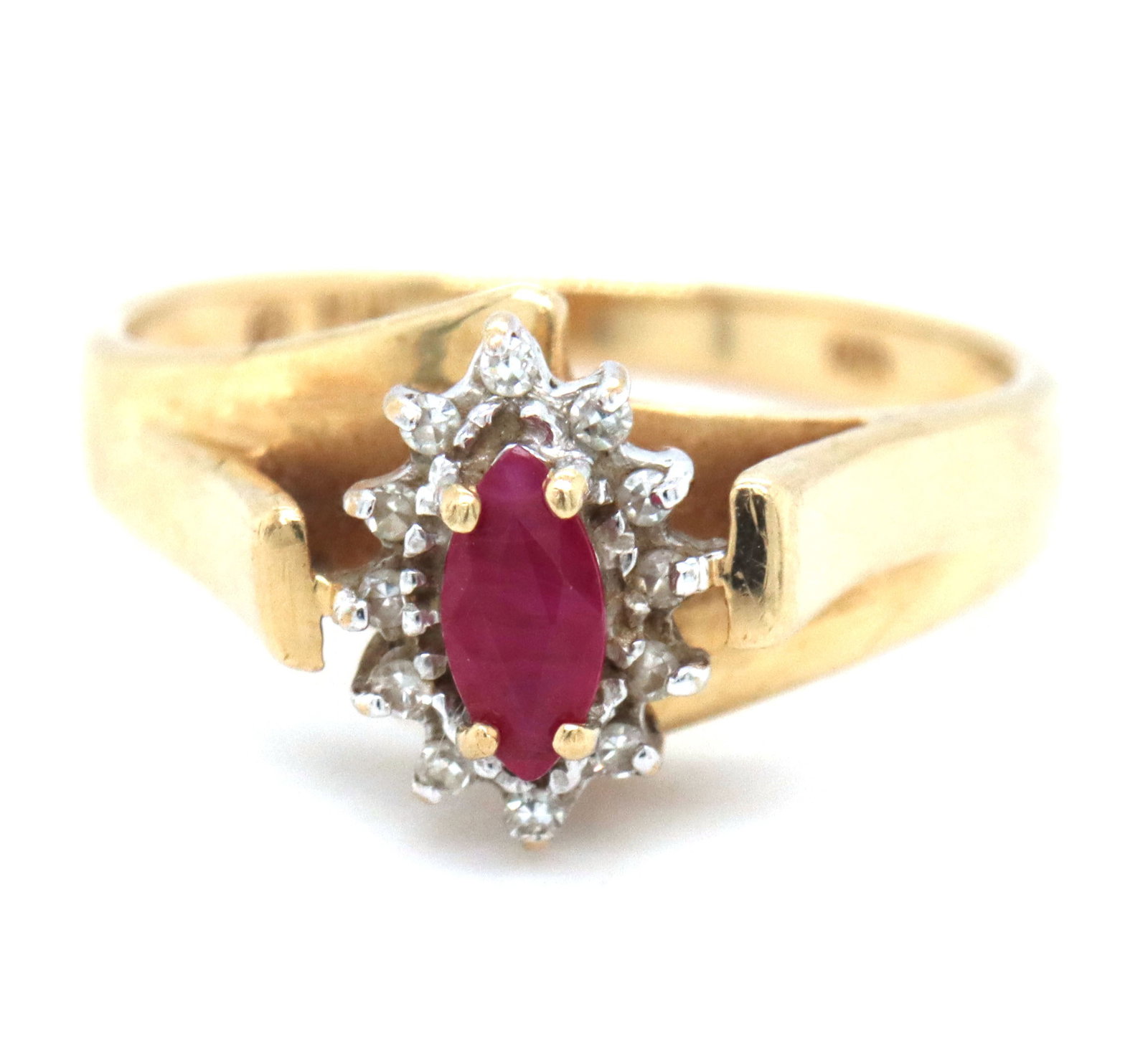10kt Yellow gold ruby and diamond ring: 10kt Yellow gold ruby and diamond ring. The total weight of the ring is 2.3 grams. Ring size 6".