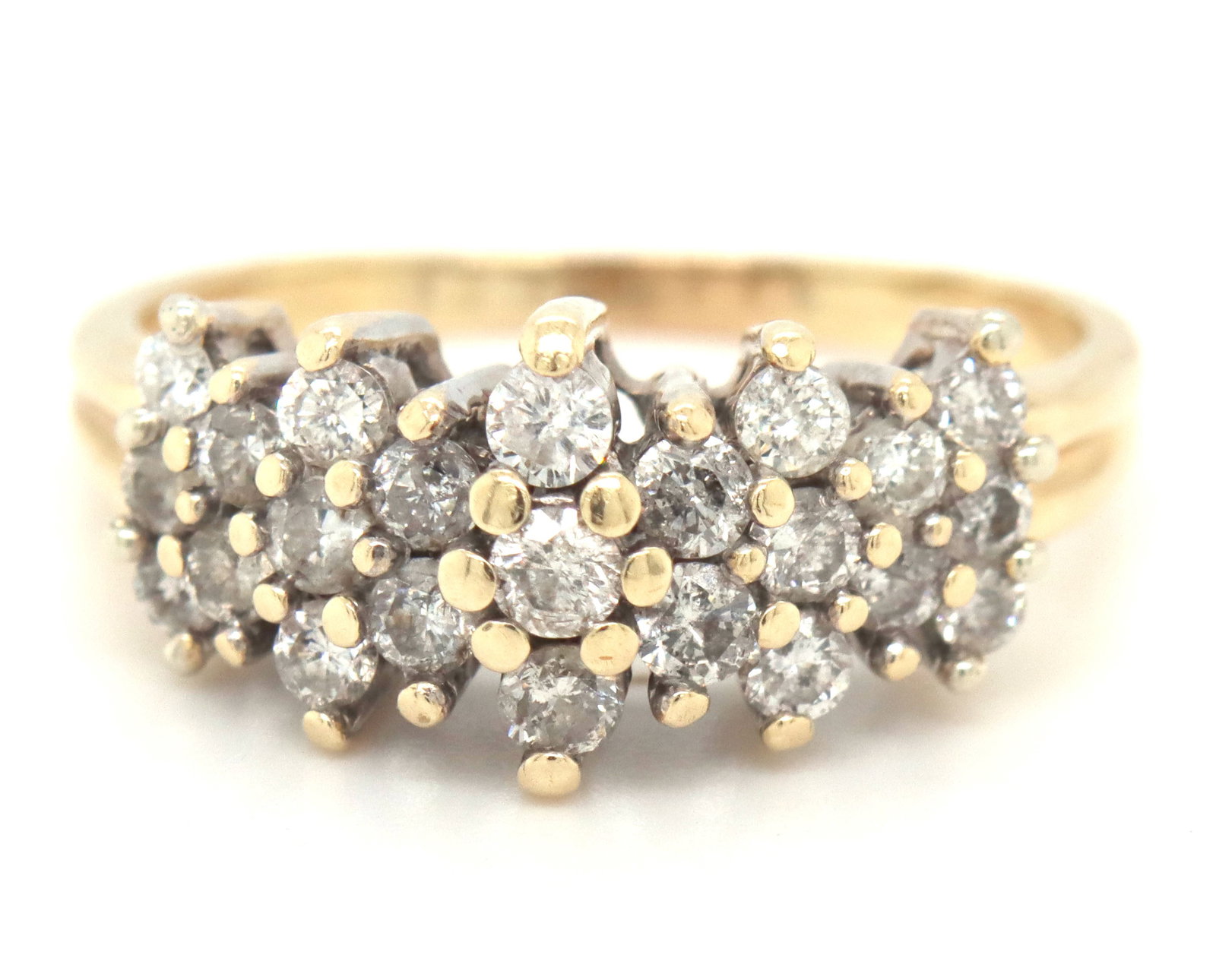 14kt Yellow gold diamond cluster ring: 14kt Yellow gold diamond cluster ring. The total weight of the ring is 5.5 grams. Ring size 9.5".