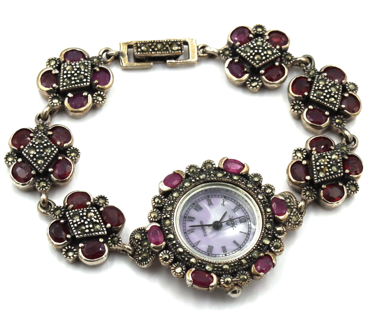 925 Sterling silver and ruby ladies watch: 925 Sterling silver and ruby ladies 7-inch watch. The total weight of the watch is 54.30 grams.