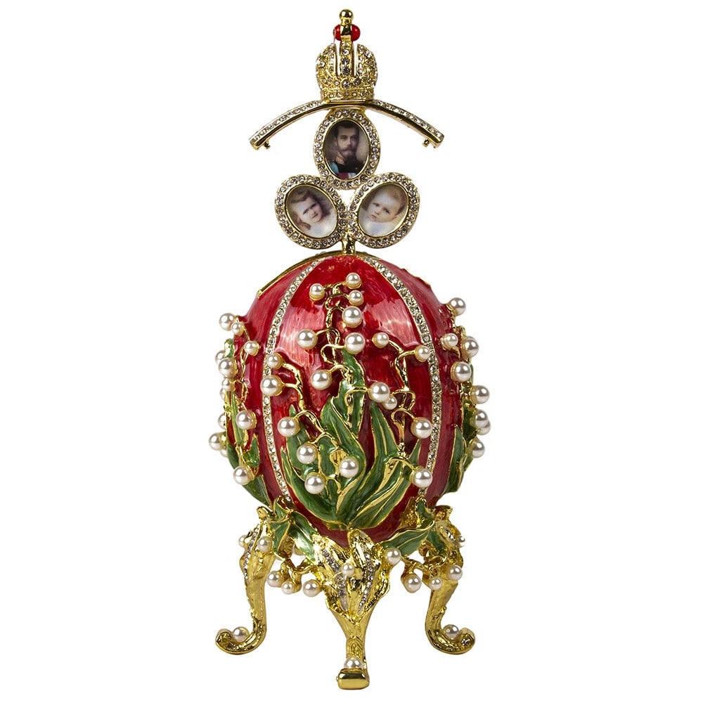 Red Lily of the Valley Faberg? Egg Replica ? Perfect Easter or Collectible Gift: Celebrate artistry and elegance with this stunning?Red Lily of the Valley Faberg? Egg Replica. Expertly crafted from metal, enamel, and crystal, this collectible piece features Swarovski crystal accen