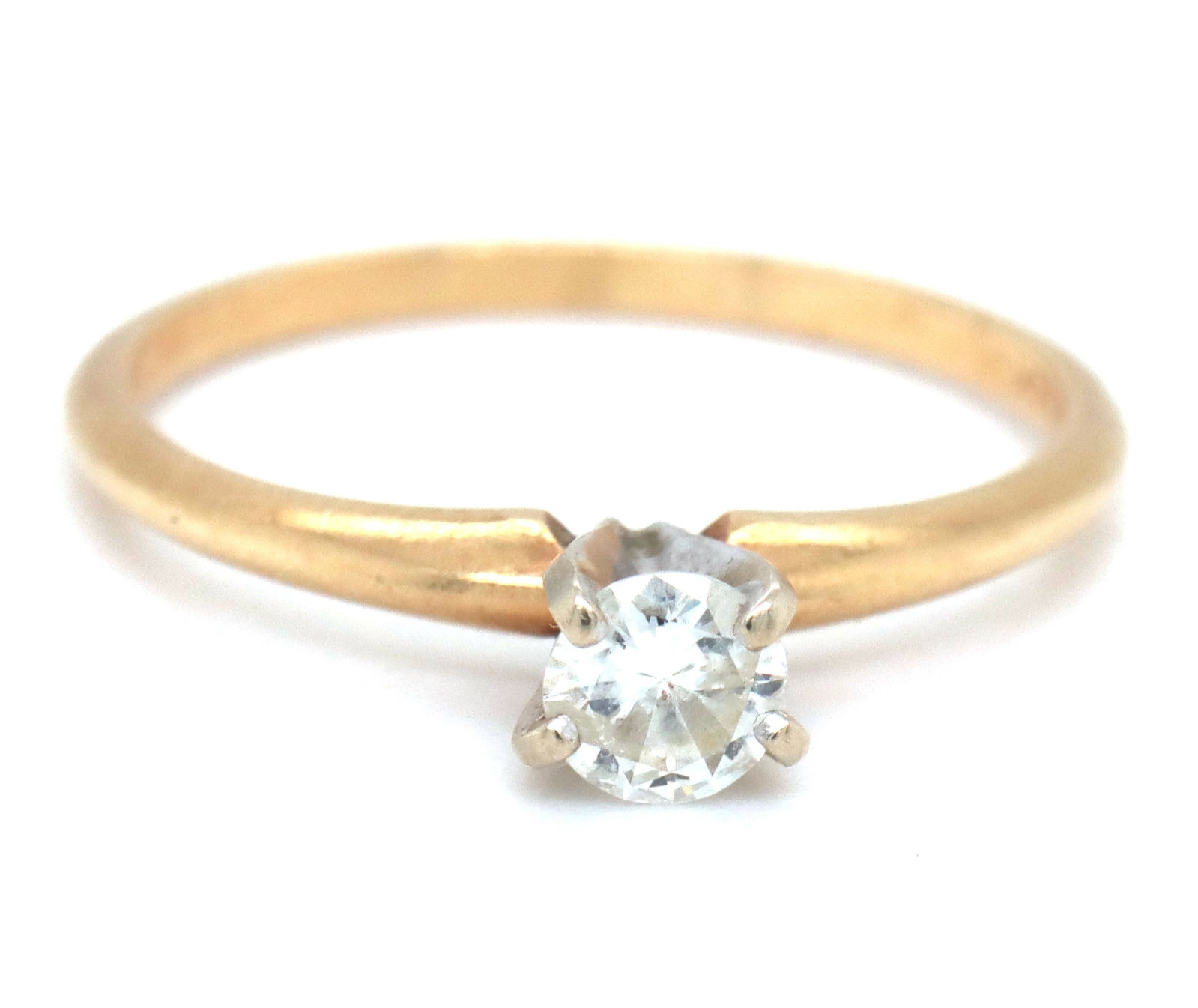 14kt Yellow gold 1/4ct round brilliant cut diamond ring: 14kt Yellow gold 1/4ct round brilliant cut diamond ring. The total weight of the ring is 1.6 grams. Ring size 6".
