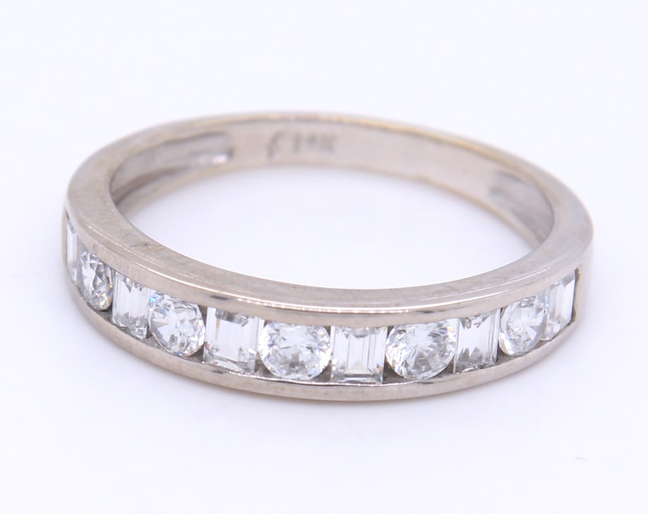 Dazzling 14KT White Gold Round and Baguette Cubic Zirconia Band: Dazzling 14kt White Gold Alternative Round and Baguette Cubic Zirconia Band. Total weight of Band 2.6 Grams. Ring Size 7"