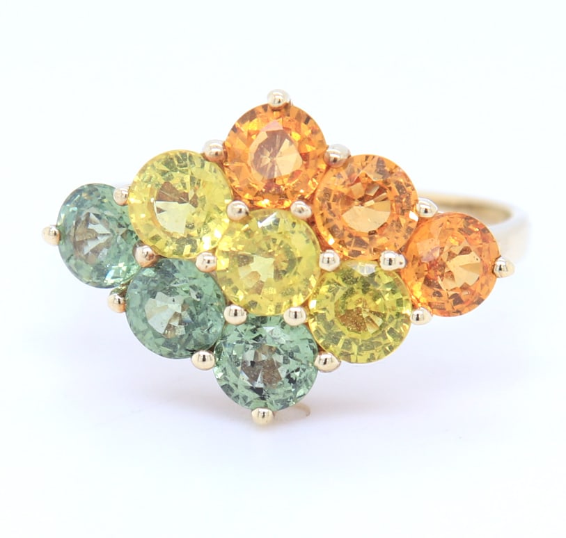 Charming Yellow Gold Multi Color Topaz Ring: Charming 10kt Yellow Gold Yellow, Orange and Green Topaz Ring. Total weight of Ring 3.2 Grams. Ring size 7.5"