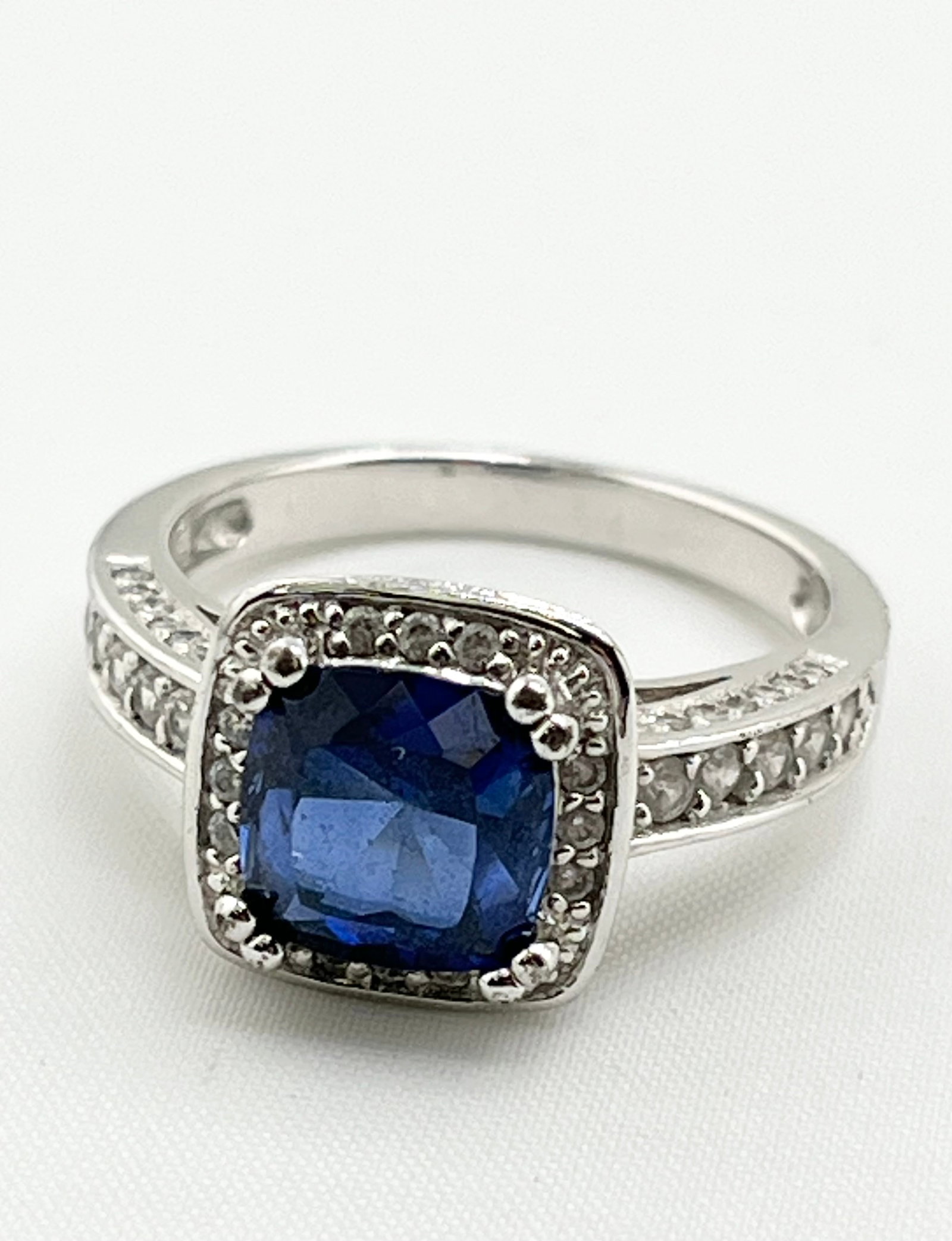 925 Sterling Silver Two Carat Blue Sapphire With CZ Halo ring: 925 Sterling Silver Two Carat Blue Sapphire And CZ Halo Ring. 5.2 grams. Size 8