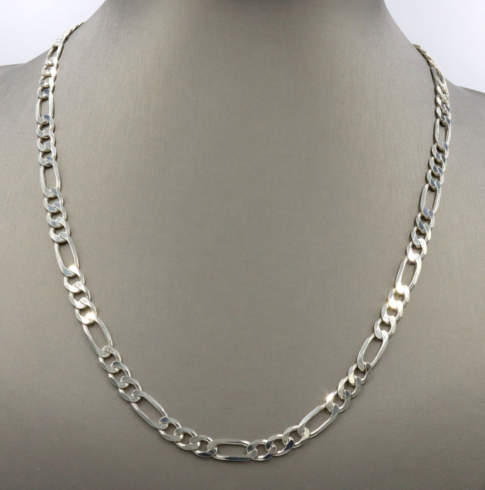 925 Sterling silver Figaro chain necklace: 925 Sterling silver Figaro 20-inch chain necklace with lobster clasp. The total weight of the chain is 22.3 grams.
