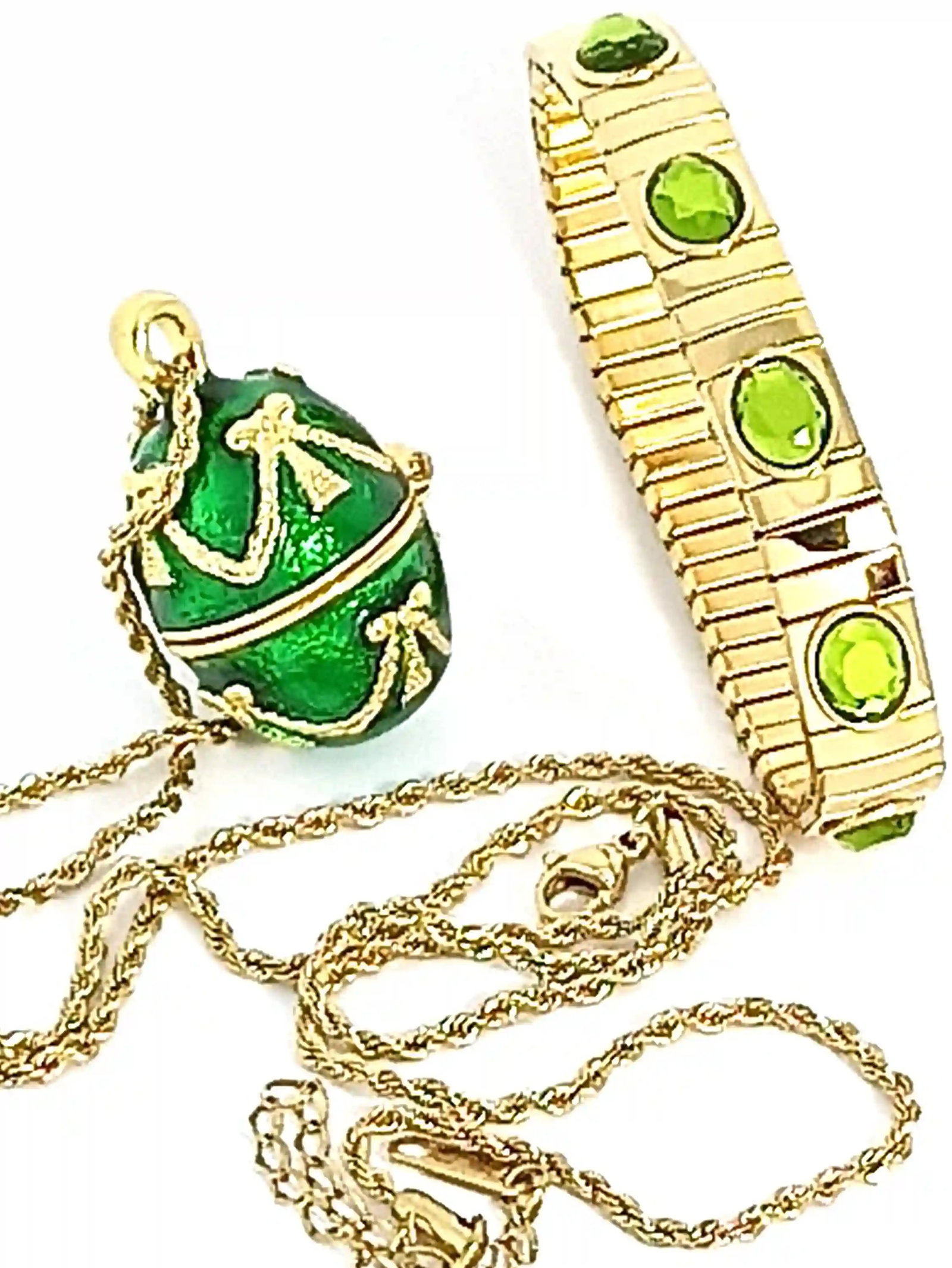 Timeless Elegance Emerald Green Vintage Egg Jewelry Set: Step into old-world glamour with this emerald green vintage-inspired jewelry set, featuring an ornate egg pendant necklace and a coordinating crystal-accented bracelet. Designed to capture the