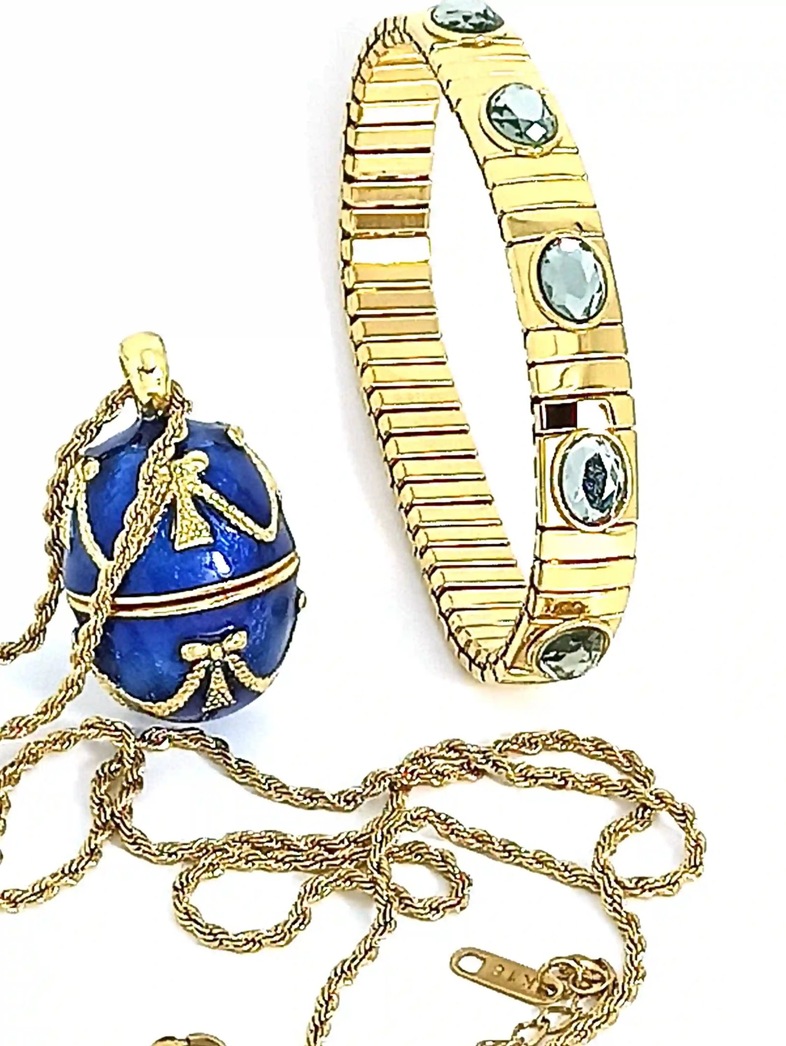 Imperial Sapphire Blue Egg Pendant Necklace & Bracelet Set in 24K Gold Vermeil: Indulge in timeless opulence with this handcrafted sapphire blue jewelry set, inspired by the grandeur of imperial egg masterpieces. Rich guilloch? enamel shimmers beneath layers of luminous sapphire 