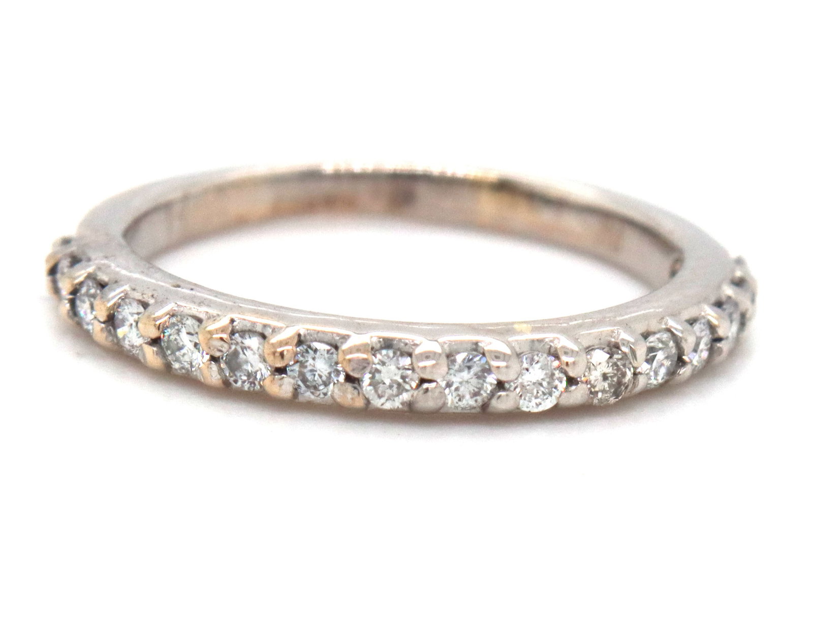 14kt White gold 0.25ctw prong set diamond band: 14kt White gold approximate 0.25ctw prong set diamond band. The total weight of the band is 1.50 grams. Ring size 3.5".