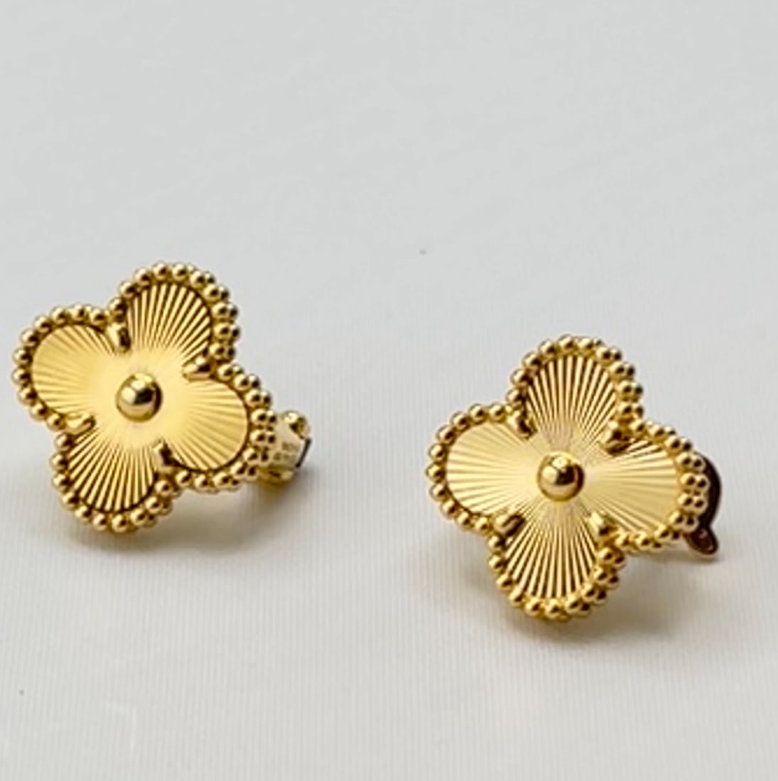 18KT Yellow Gold Guilloch? Pattern Post & Clip Earrings 6.2 Grams, Handcrafted Design: Elegant 18KT yellow gold earrings featuring a finely detailed guilloch? pattern. These handcrafted earrings are designed with both post and clip-back closures, offering added security and comfort. Ple