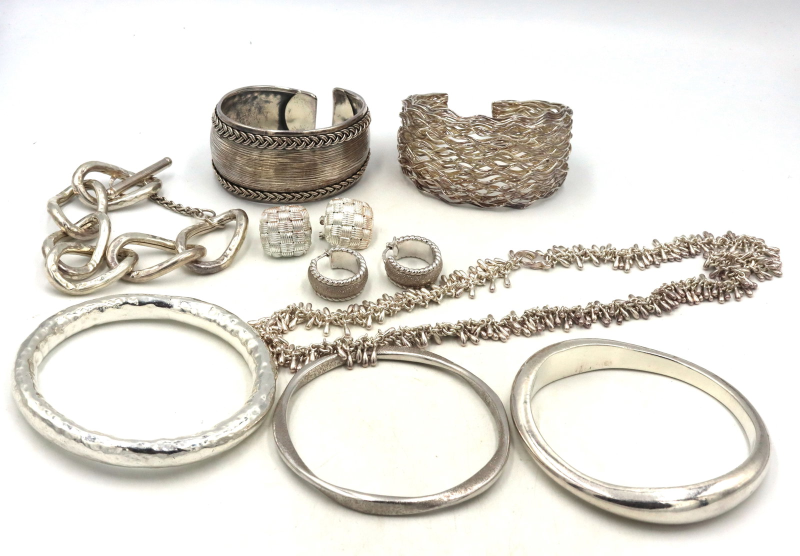 Big group lot of 925 sterling silver mixed jewelry: Big group lot of 925 sterling silver mixed jewelry. 2 Pairs of earrings. bracelet, necklace, 2 cuff bangles and 3 bangles. The total weight of lot is 254.90 grams.
