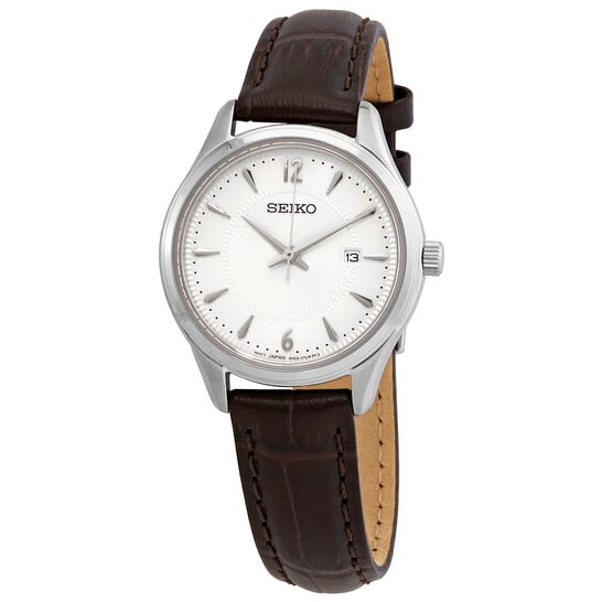 Seiko Women?s Quartz Watch Silver Dial Brown Leather Strap 30mm Classic: Elegant and understated, this Seiko women?s watch blends classic design with everyday functionality. The polished stainless steel case is paired with a rich brown leather strap, creating a timeless