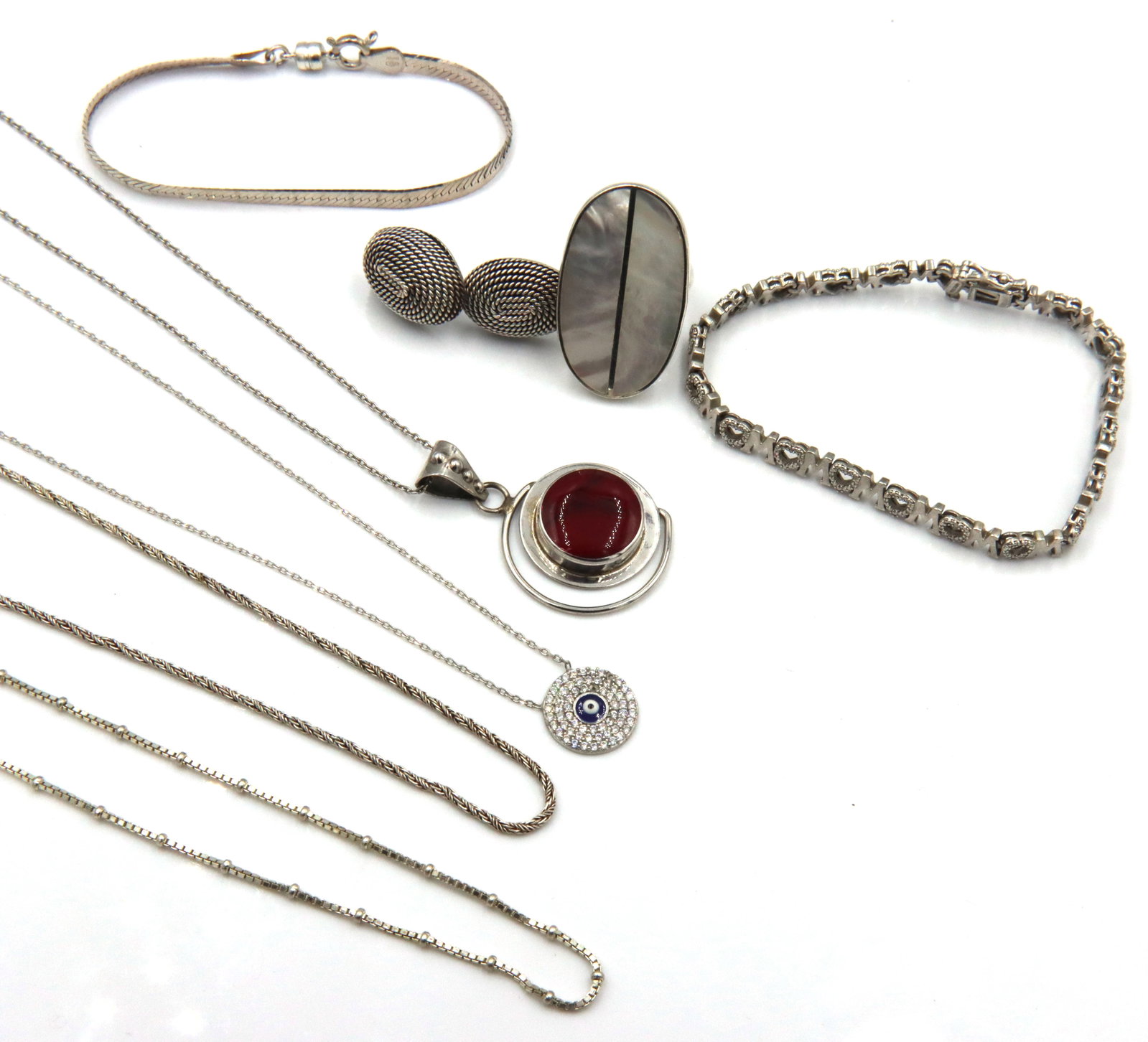 Group lot of Vintage 925 sterling silver mixed jewelry: Group lot of Vintage 925 sterling silver mixed jewelry. 7.25-inches M heart shaped link bracelet, 7-inches Italian herringbone bracelet. One pair of signed Mexico earrings. Ring size 7.75". 24-inch bo