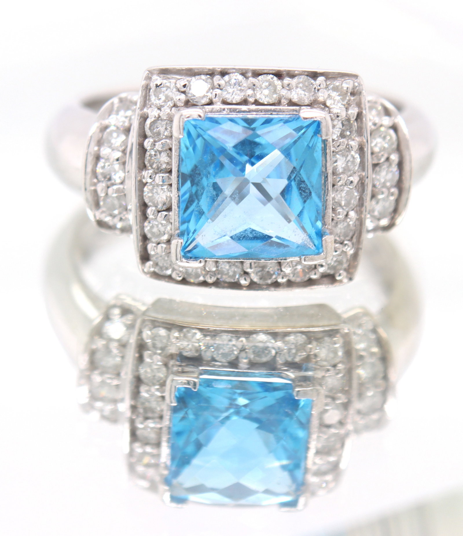 14kt White Gold approximate 1.60ct Blue Topaz and 0.30ctw Diamond Ring: 14kt White Gold approximate 1.60ct Blue Topaz and 0.30ctw Diamond Ring. Color G. Clarity I. Total weight of Ring 5.40 Grams. Ring Size 7".