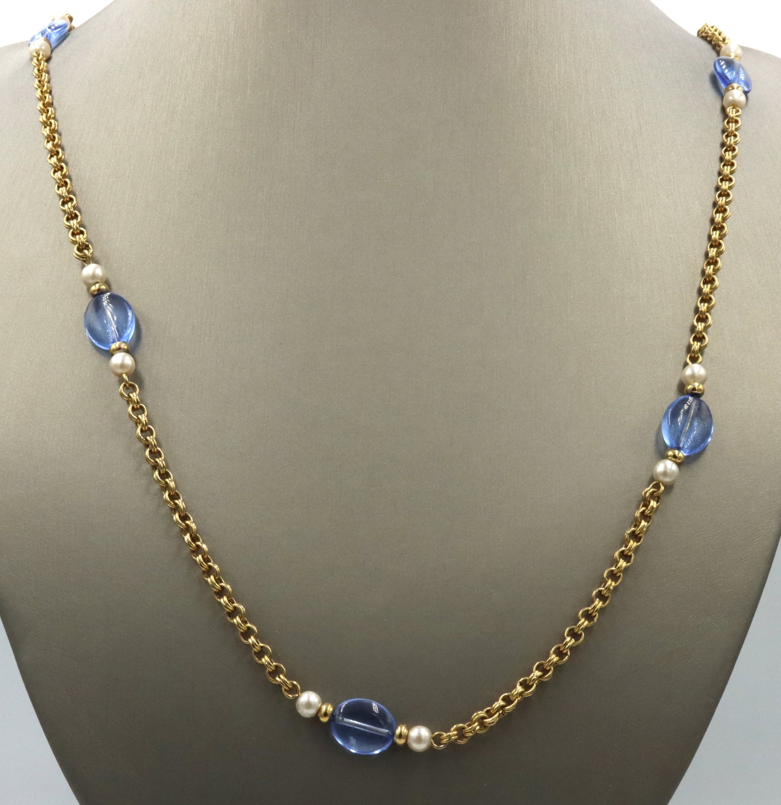 Vintage Avon gold plated pearl and glass necklace: Vintage Avon gold plated pearl and blue glass 36-inch necklace with spring ring clasp. The total weight of the necklace is 28.7 grams.