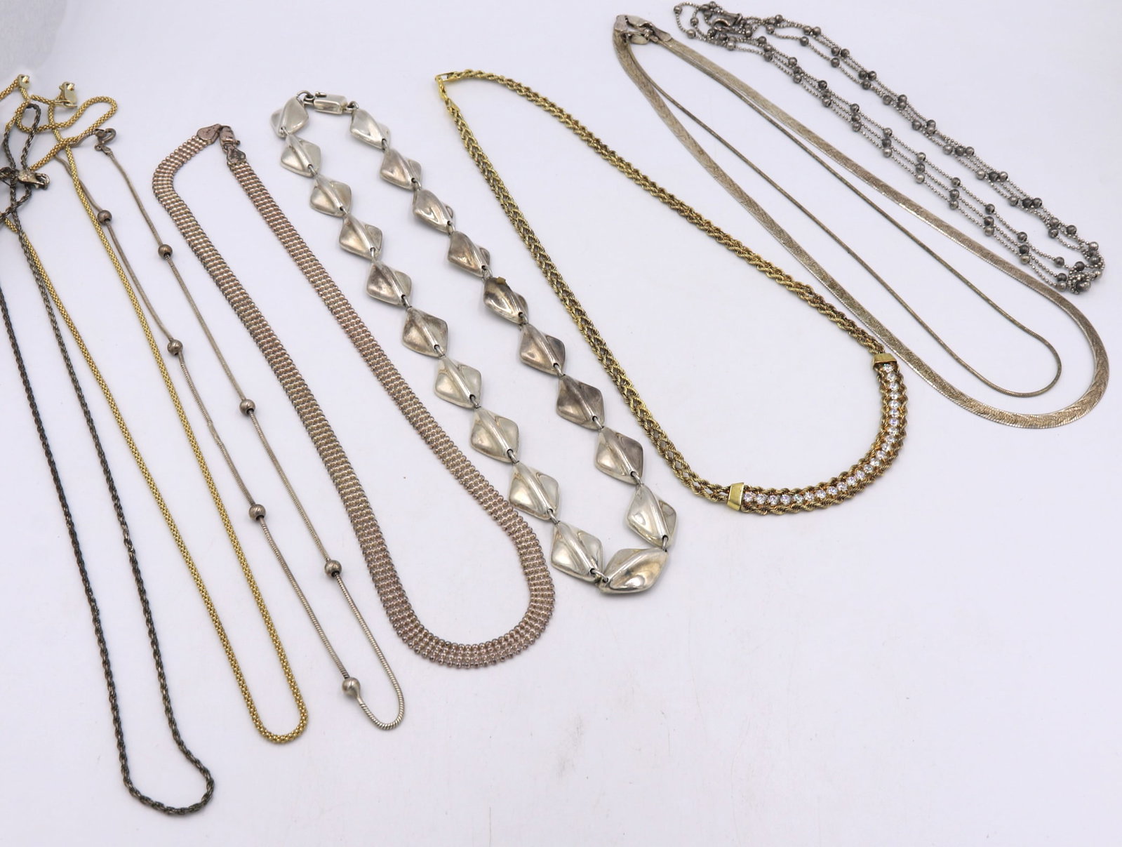 Group lot of 9 Vintage 925 sterling silver chains: Group lot of 9 Vintage 925 sterling silver chains. Total weight of lot 100.5 grams.
