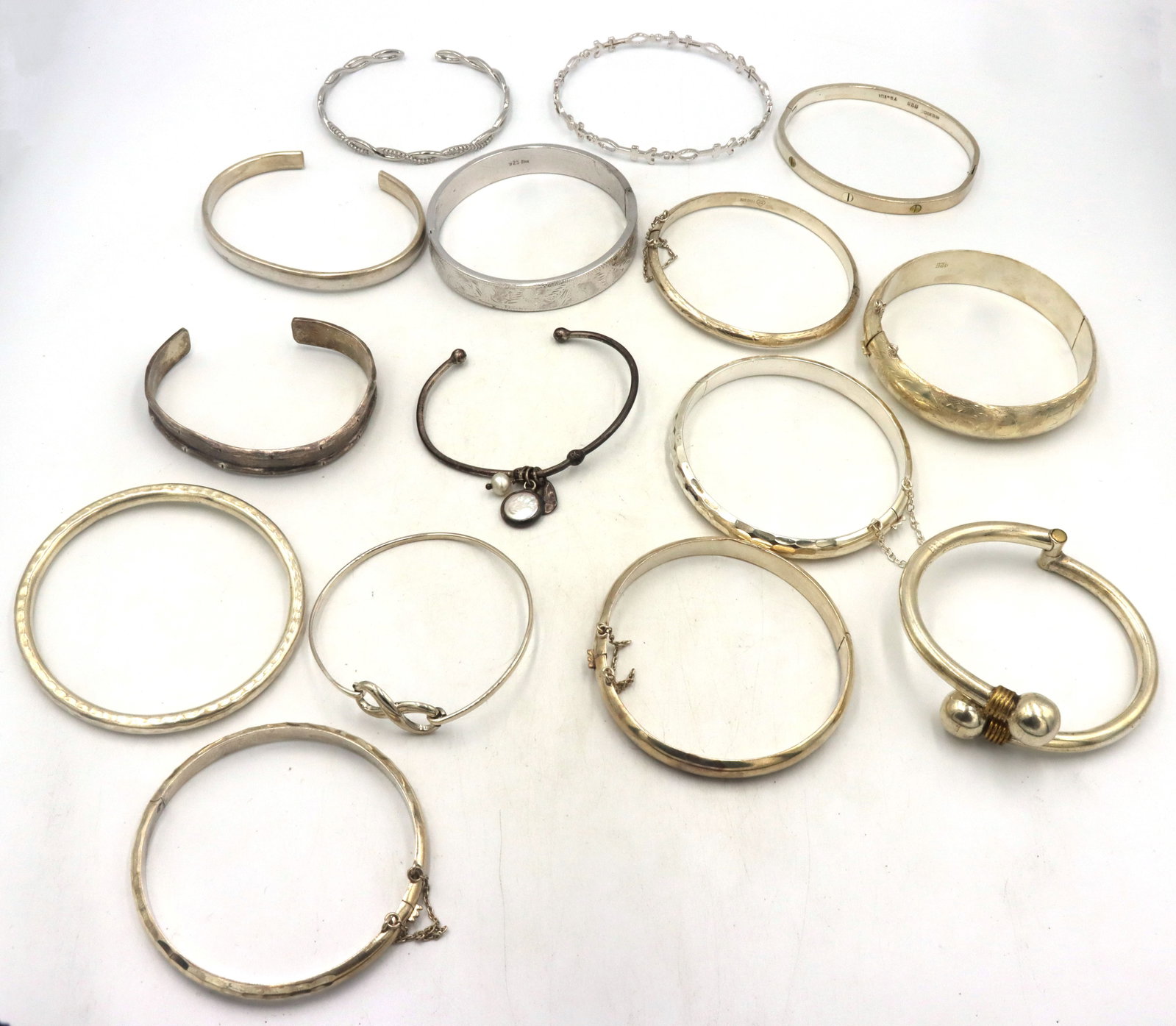 Big group lot of vintage 925 sterling silver bangles: A big group of vintage 925 sterling silver bangles. Mixed styles and sizes. The total weight of the lot is 333.2 grams.
