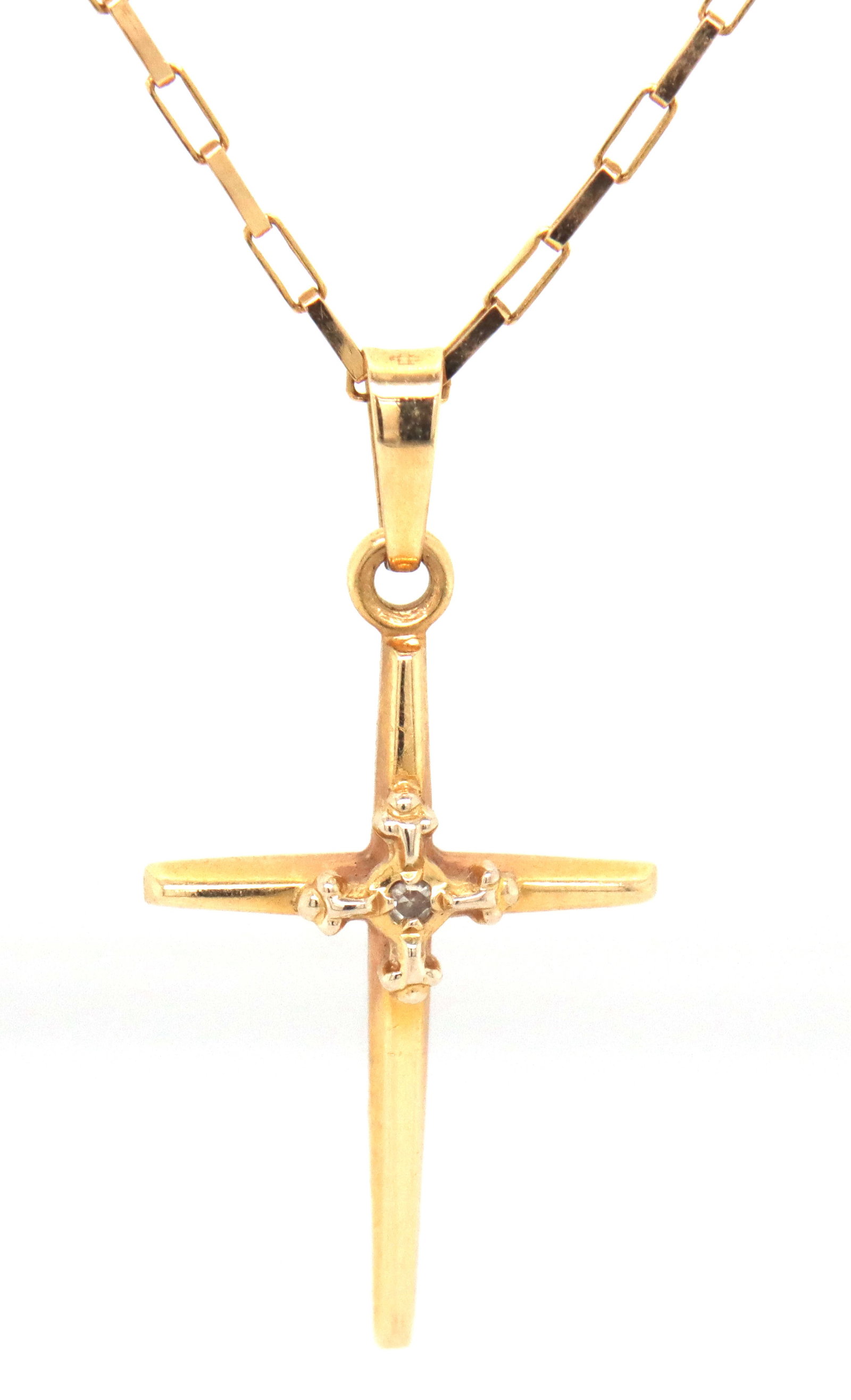 14kt Yellow gold cross pendant on chain: 14kt Yellow gold cross pendant on 16-inch chain necklace with spring ring clasp. The total weight of the necklace is 3.2 grams.