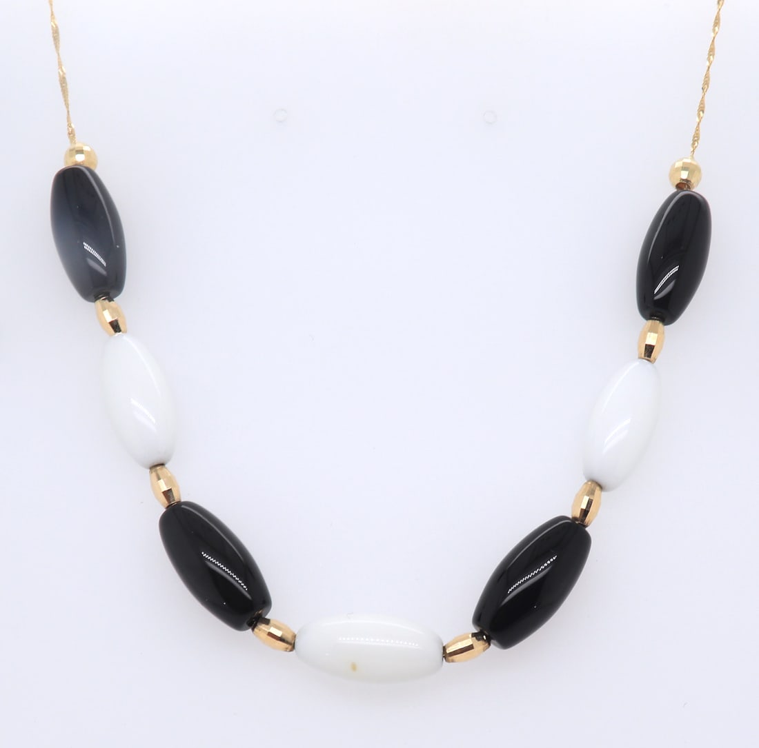 Italian 14KT yellow Gold Black and White Bead Necklace: Italian 14KT yellow gold Black and white beads 17 inches necklace. 10.5 grams.