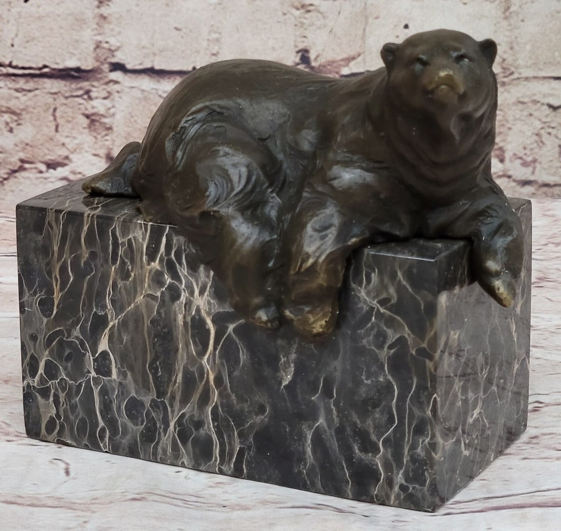 Polar Bear Bronze Sculpture: Beautiful art deco effect will enhance any home. This bronze sculpture was crafted using the lost wax method and stands on a brown marble base. Dimensions: Height 5 X Width 6 inches. Weight: 6 LBS.