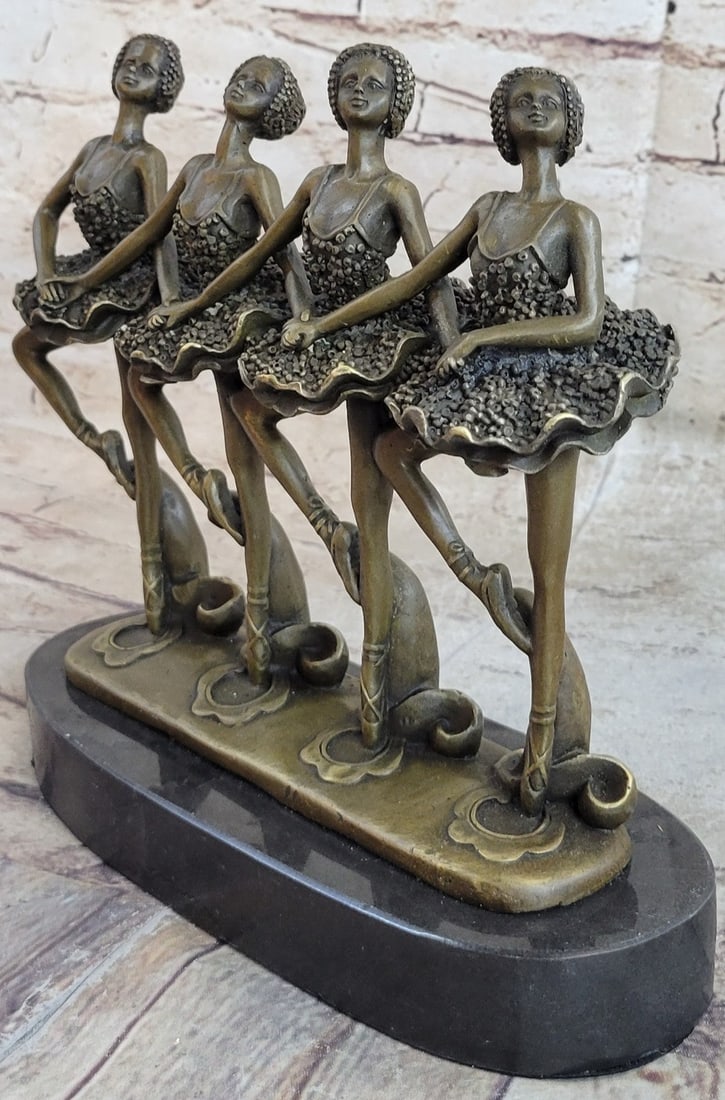 Ballerina Dancer Bronze Sculpture: A group of prima ballerinas put on a show. They are well trained in the art they love, showing their agility, balance, and flexibility. They all elevate their long leg far behind them. Their chest pus