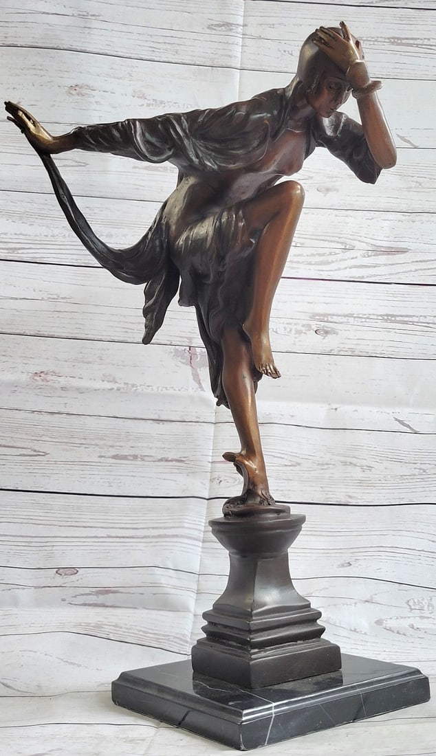 Signed Juliet Erte Striking Pose Dancer Bronze Sculpture Marble Base Satue Decor: The alluring woman is captured in a seductive pose as she bends her upper torso, hands resting on her knees, as her figure takes a L-shape. From her head to her dainty pointed toes, she wears a strap 