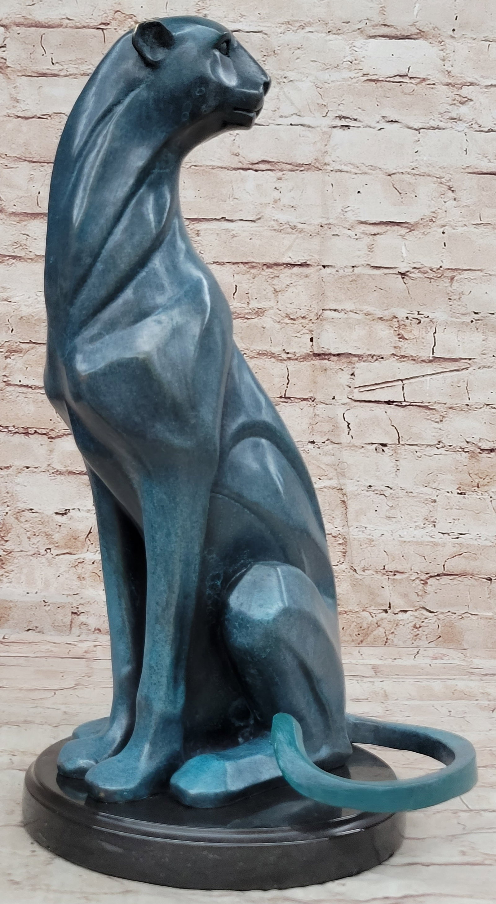 Puma Bronze Sculpture: Crafted using the revered lost wax method, every nuance of this masterpiece is carefully preserved, from the sinuous curves of the cougar form to the intricate details of its expression. Resting atop 