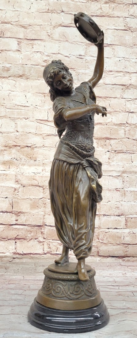 Art Nouveau Style: Gypsy Dancer Bronze Statue: This stunning bronze statue figurine, inspired by the Art Nouveau style, beautifully depicts a dancing female holding a tambourine. This sculpture was created using the traditional lost-wax casting me