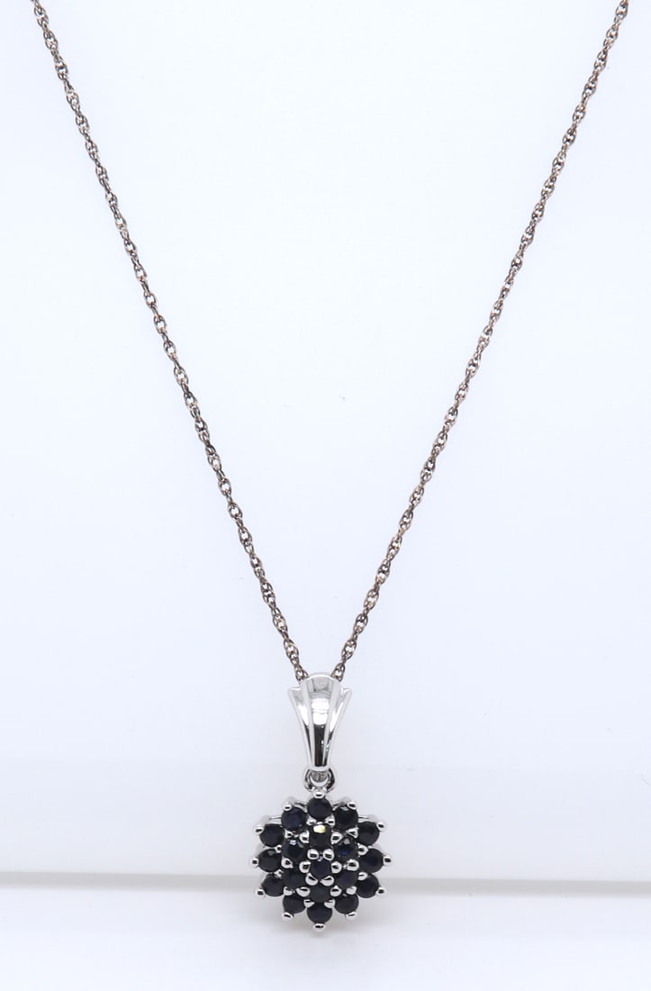 Sterling Silver Gemstone Pendant on Chain: 925 Sterling Silver Blue Gemstone Flower Style Pendant on 18" Chain Necklace. Total weight of Necklace 4.89 Grams.