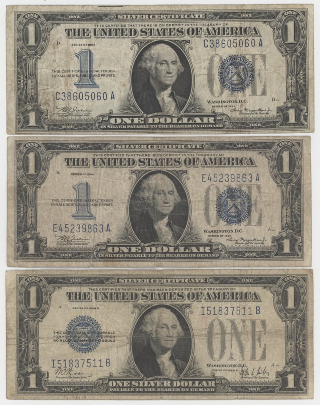 Lot of Three $1 Silver Certificates (2 1934 and 1 1957 Series) U.S. Small Size Notes: Offered is a lot of three vintage United States $1 Silver Certificates consisting of two Series 1934 notes and one Series 1957B note. These historic blue-seal notes were once redeemable for silver