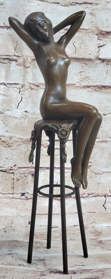 Model Sitting on Chair Bronze Sculpture: A beautiful woman seated provocatively on a very ornate chair. The whole is hot cast in genuine Bronze Metal this is a very three-dimensional Sculpture. The detail of her curvaceous body. Her legs sed