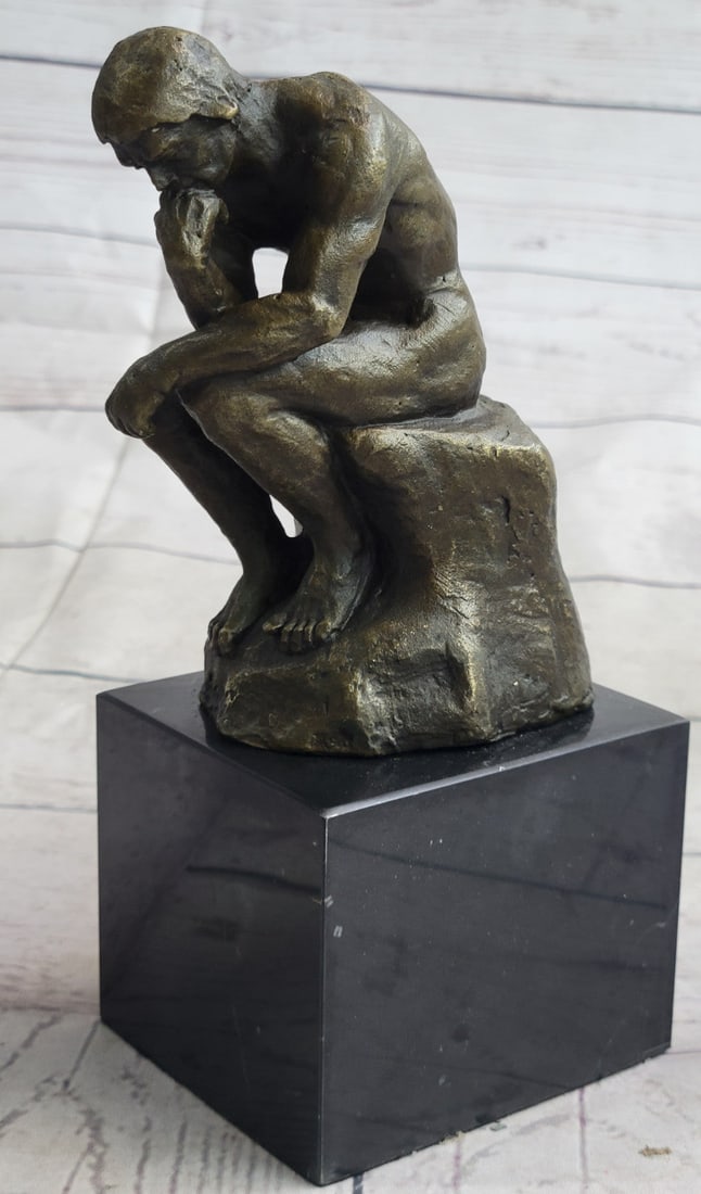 Thinker Bronze Sculpture: This bronze statue represents one of Auguste Rodin most famous sculptures, The Thinker statue. Initially named The Poet, The Thinker statue was intended to represent Dante himself at the top of the
