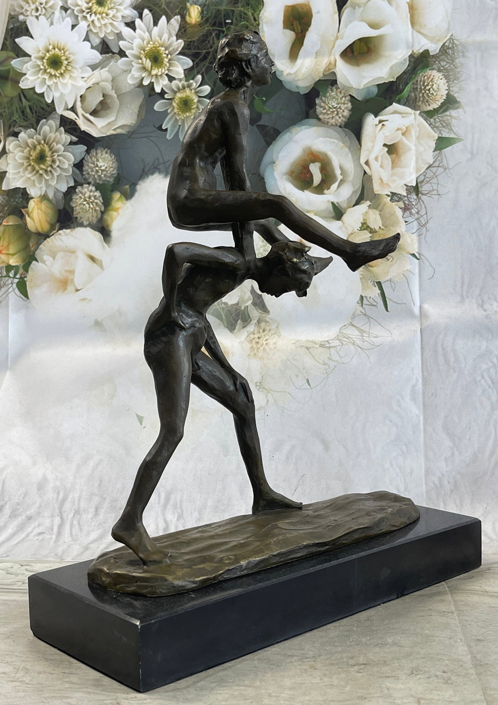 Kids Playing Leap Frog Bronze Sculpture: This statue depicts children playing leapfrog with no cares about what goes on around them. This portrays the reality of childhood innocence. The piece is made of bronze with a beautiful polished