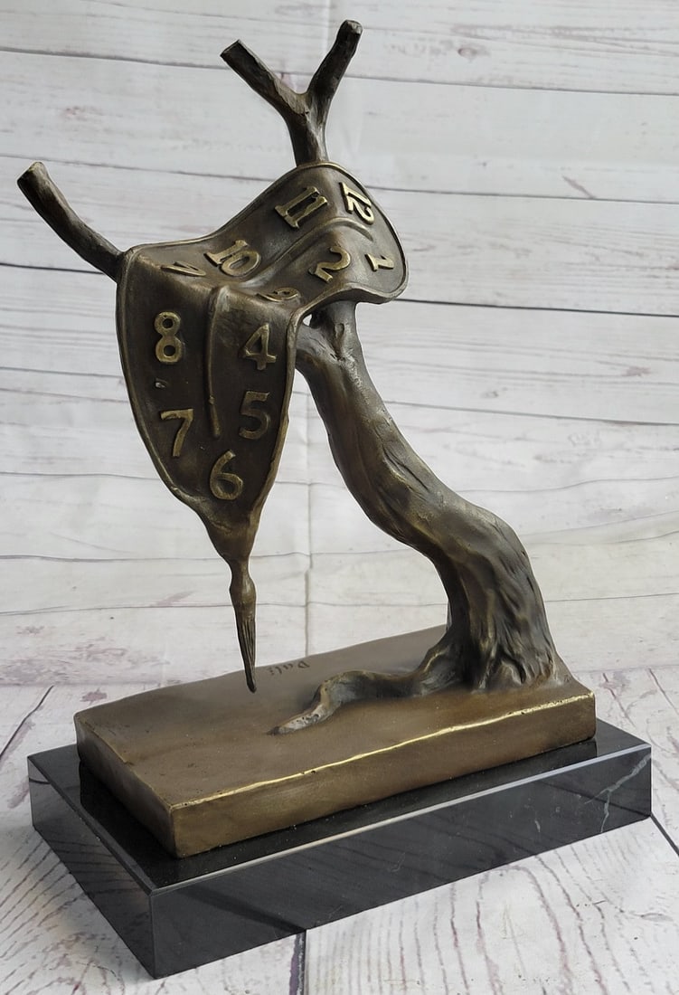 Modern Melting Clock Bronze Sculpture: This Bronze Sculpture was crafted using the lost wax method and it stands on a marble base. Dimensions: Height 12 X Width 8 inches. Weight: 10 LBS.