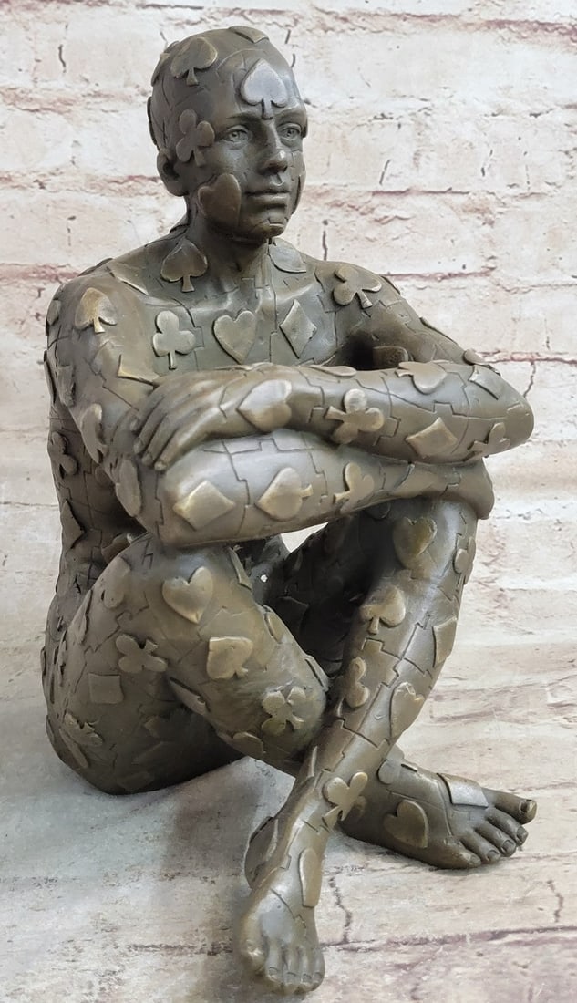 Man with Poker Outfit Bronze Sculpture: This abstract is a very odd and creative one, I guarantee you that you will have people talking about it. You can tell it is a figure of a man sitting wearing a poker design outfit, but the