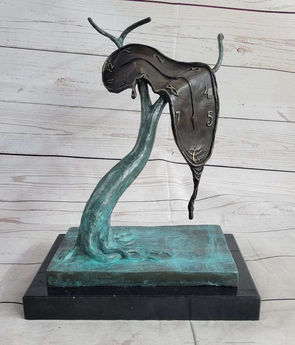 Melting Clock Bronze Figurine: With this sculpture, It is an uncomplicated form composed of a melting watch draped over the branch of a tree. The materialization of the flexibility of time and the indivisibility of time and space. 