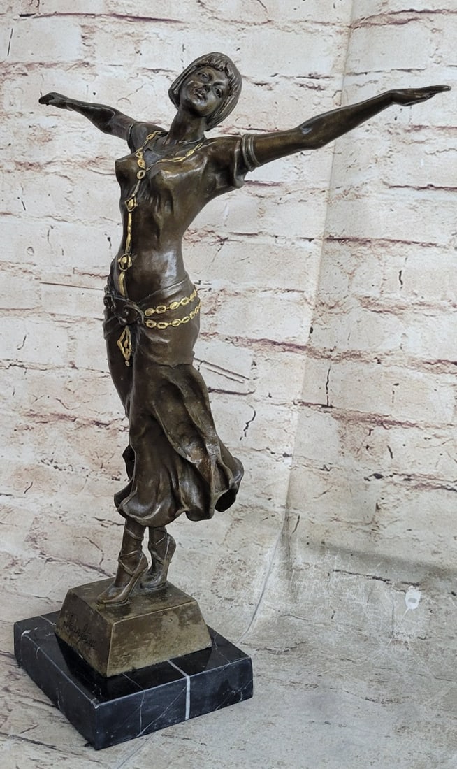 Naked Girl Bronze Sculpture: A great dancer is so into her craft that she often looks lost in a trance as she moves. Lost in the movement of her graceful body. This nude dancer is just that. Balancing only on her toe with the oth