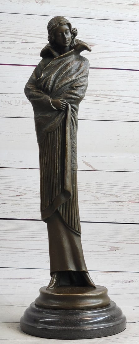 Young Woman with Long Jacket Bronze Sculpture: The Young Girl Can Be Imagined Walking Around Her Garden In The Early Morning Sunlight Exercising Her Green Thumb. Her long jacket Wraps Around Her, Pulled Back By The Wind, As Her Eyes Face The