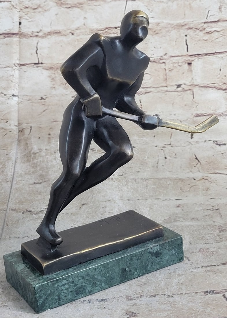 Passing Hockey Player Bronze Statue on Marble Base Sculpture: This beautiful Hockey Genuine Bronze Sculpture is mounted on a marble base with Bronze Dark brown patina. you can engrave event artwork, logos, mascots, and event verbiage into these beautiful Bronze 