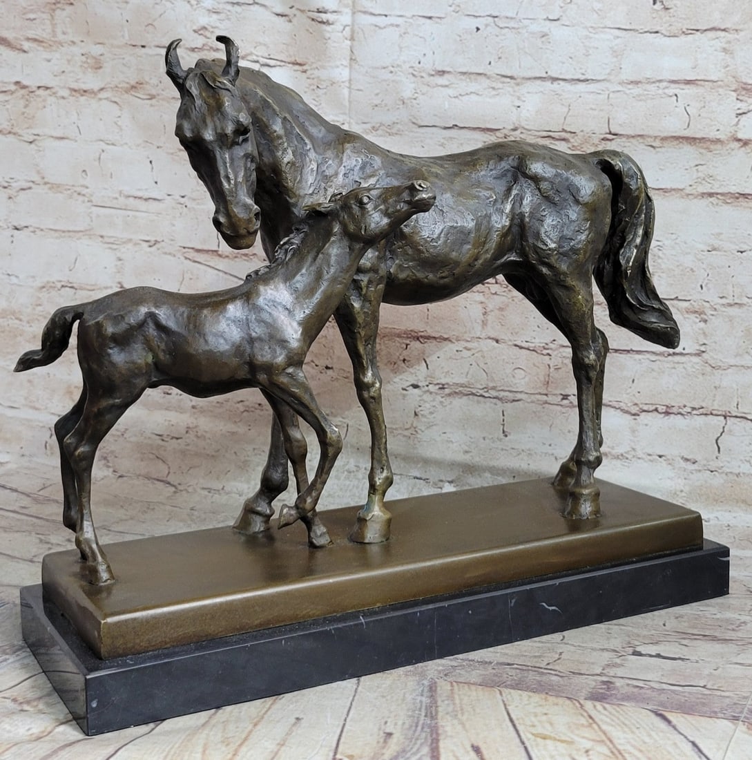 Mare And Foal Horse Bronze Sculpture: The mare and foal stand in the high grasses of a meadow at the dusk of day. The foal rubs her neck along her mothers a gesture of love as the subtle hint of a smile finds itself on both their mouths. 