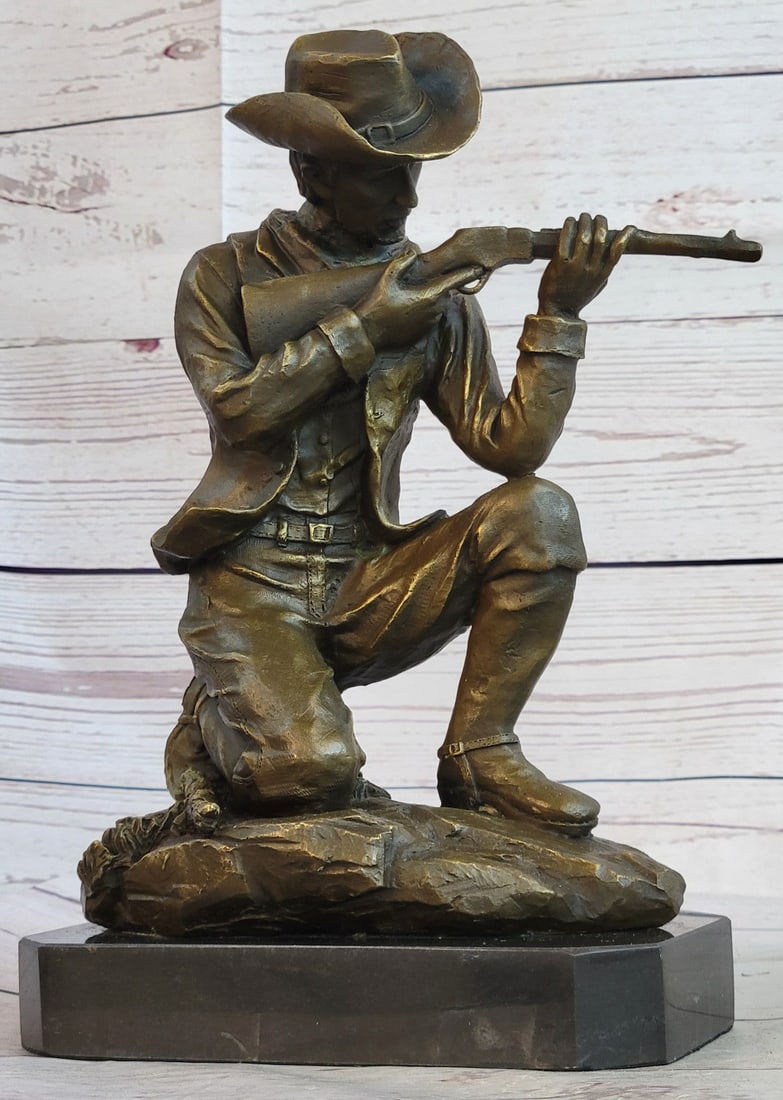 Cowboy With Gun Bullet Rifle Shooting Range Bronze Sculpture: Here is a wonderful Sculpture of a Cowboy shooting a rifle in the old west, in midrun shooting range with his arch-enemy. The detail of this Statue is remarkable with the smaller detail of the hat, bu