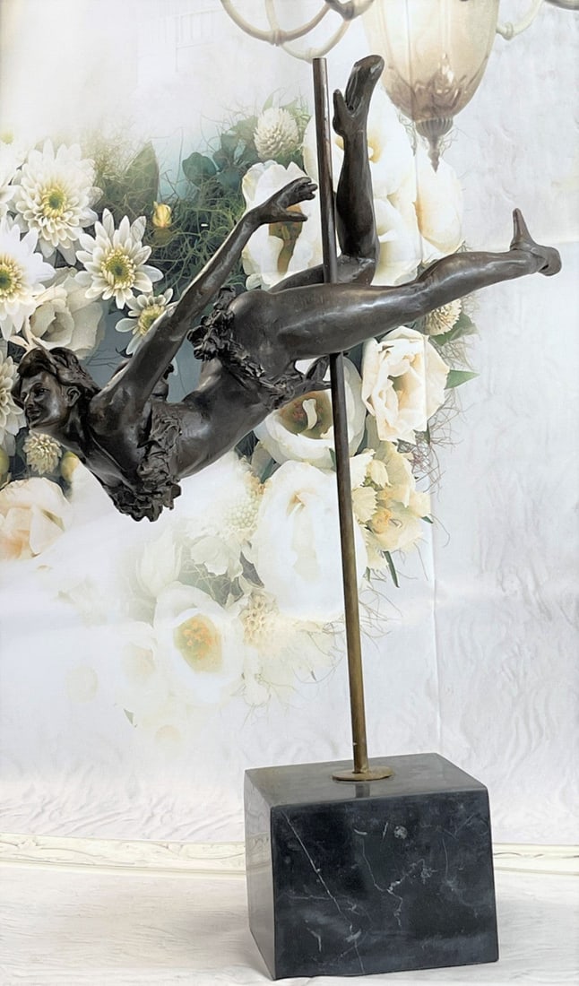 Lovely Bronze Statue: This woman is a talented Gymnast demonstrating her agility and flexibility. Balancing on a pole as she has trying to amuse you. Her muscular legs curve backward and rest in her hands on her shoulders.
