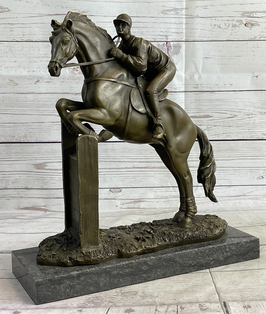 Jockey Bronze Sculpture: This thoroughbred and jockey are on a mission to win first place. In full stride, this horse gallops its way to a fast finish. Running on a grass track this horse refuses to lose this derby. He exerts