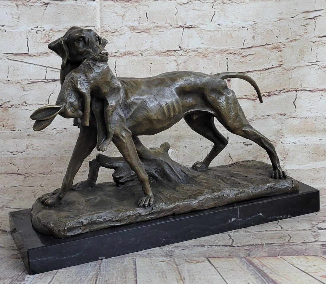 Dog Retriever Rabbit Bronze Statue: The hunting dog, amidst the fog of early morn, stands looking at its owner quizzically. The dog was cast using the archaic method of lost-wax casting and stained with a brown patina finish for