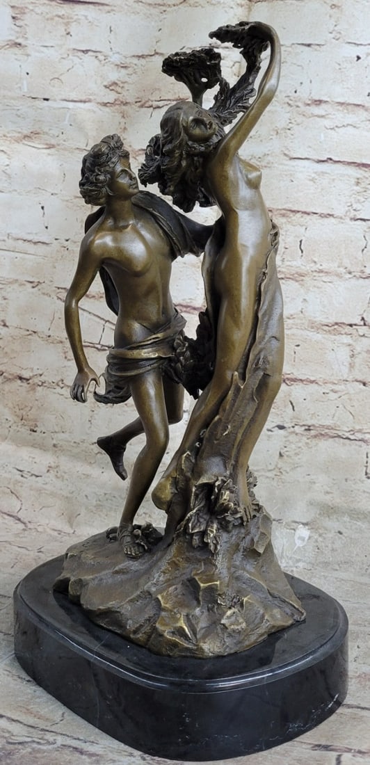 Apollo and Daphne Bronze Sculpture: This is a bronze replica of Apollo and Daphne. Apollo grows impatient and soon, sped by Eros, gains on her. With slower speed and failing strength, Daphne cries out to her father just as Apollo