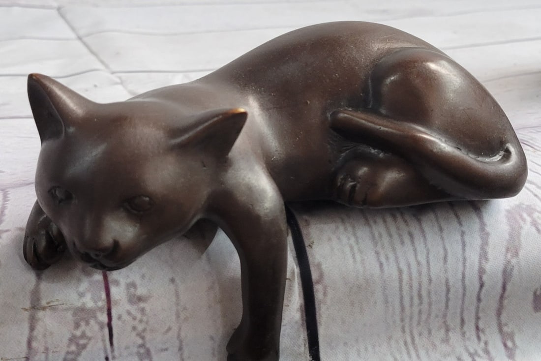 Desk Top Adorable Cat Bronze Sculpture: This is the most adorable cat anyone can own, he rests on the edge of things as any normal cat does, Cats are similar in anatomy to the other fields, with strong, flexible bodies, quick reflexes,