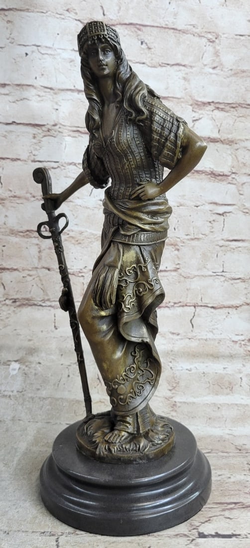 Persian Princess With Sword Bronze Sculpture on Marble Base Figurine: The bewitching Persian Princess stands defiant and proud amongst the bustling crowd around her. She stands in a classical contrapposto position dressed in attire with impeccable detail and realness. H