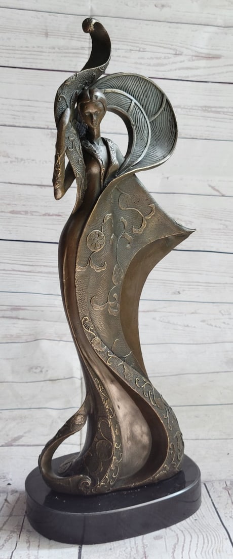 Brown Patina Bronze Sculpture: Beautiful elegant artwork, Fashion Girl. Features a young sophisticated beauty poised in mid-motion arms gently swaying and body raised on tiptoes. A subtle gesture of refined movement and power and